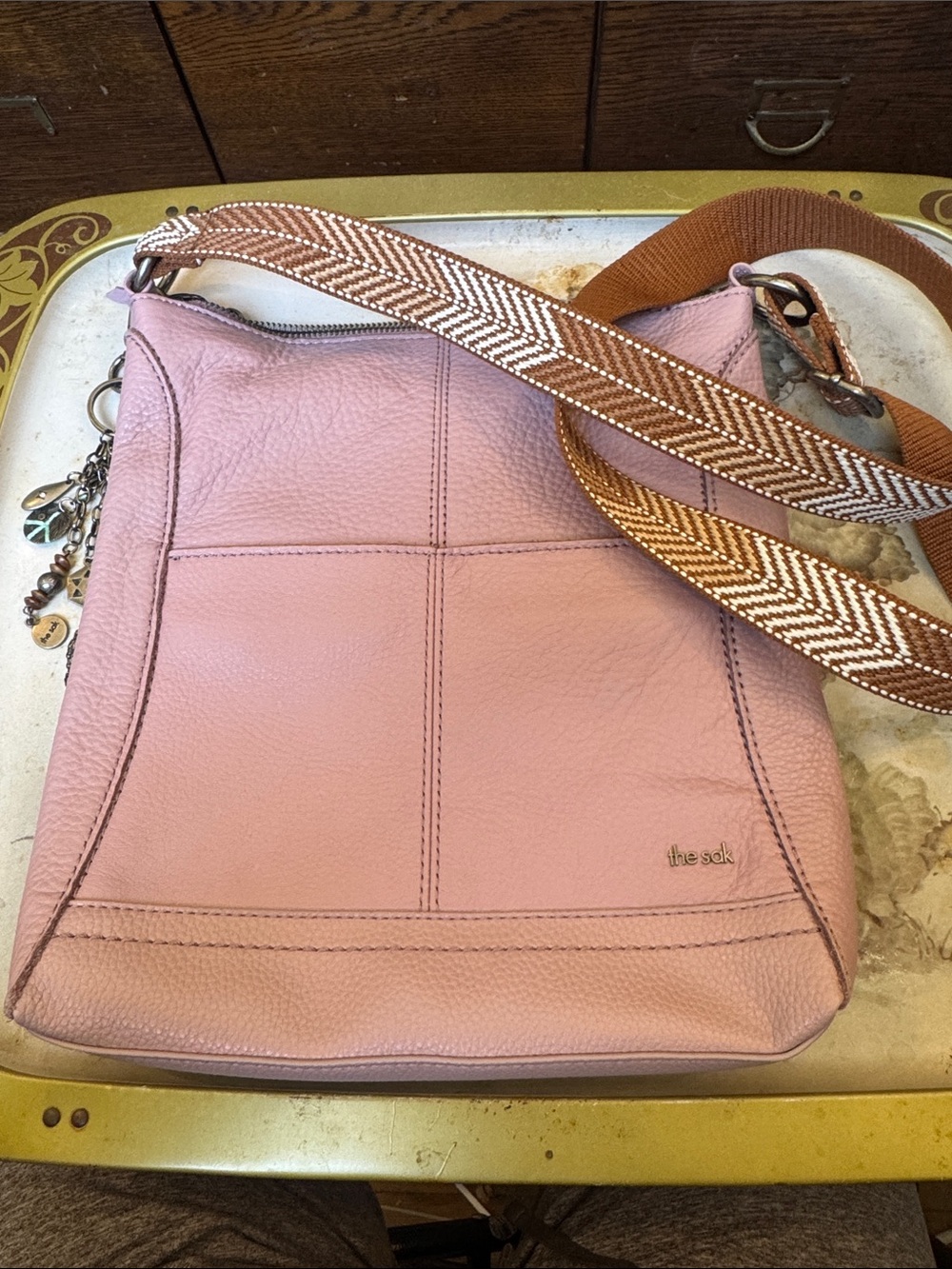 The Sak Pink Pebbled Leather Crossbody with Patterned Brown Strap